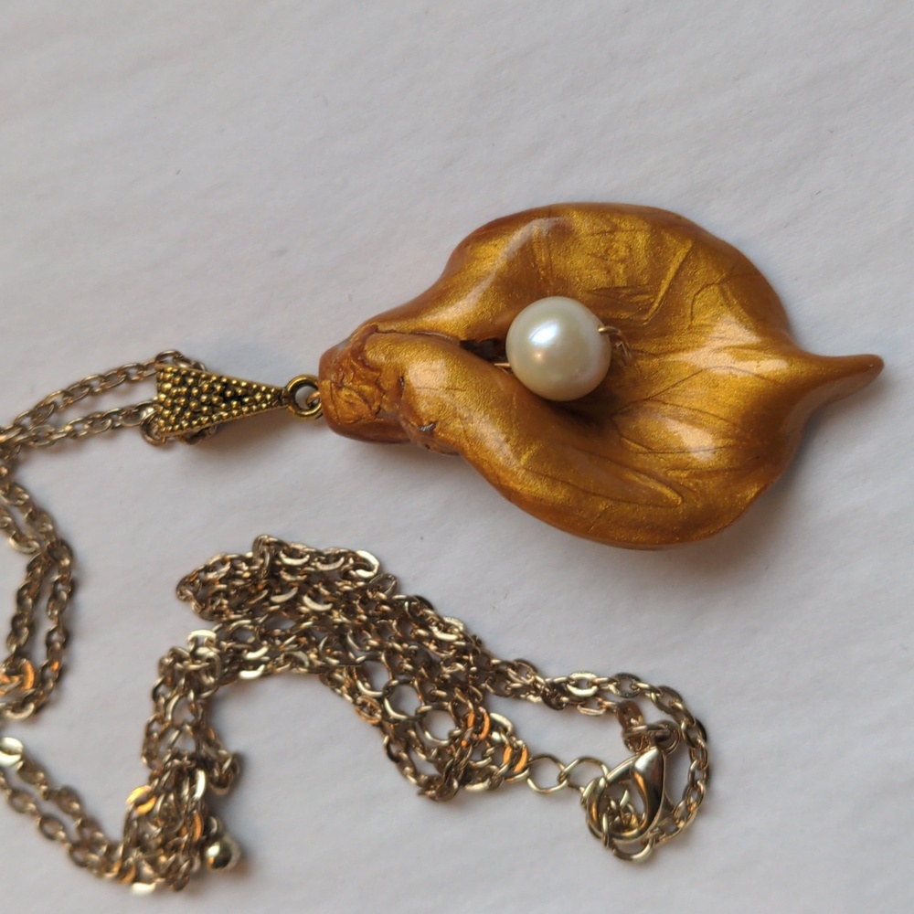 New Handcrafted pendant. Gold polymer clay and genuine pearl. Antique 24" chain.